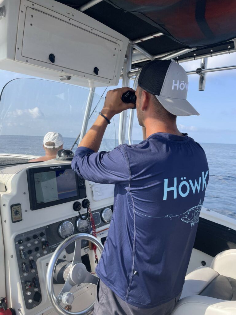 Divateam skipper scanning the sea for fish