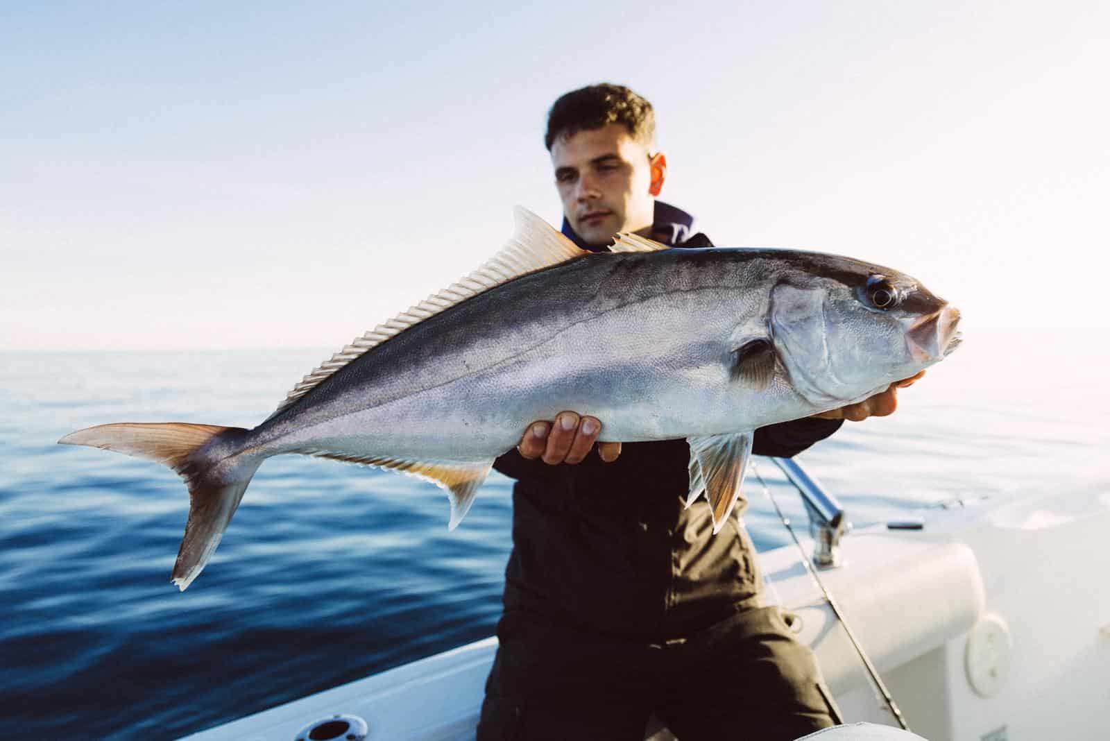 Angler with a big catch on a guided fishing trip on the Costa Brava